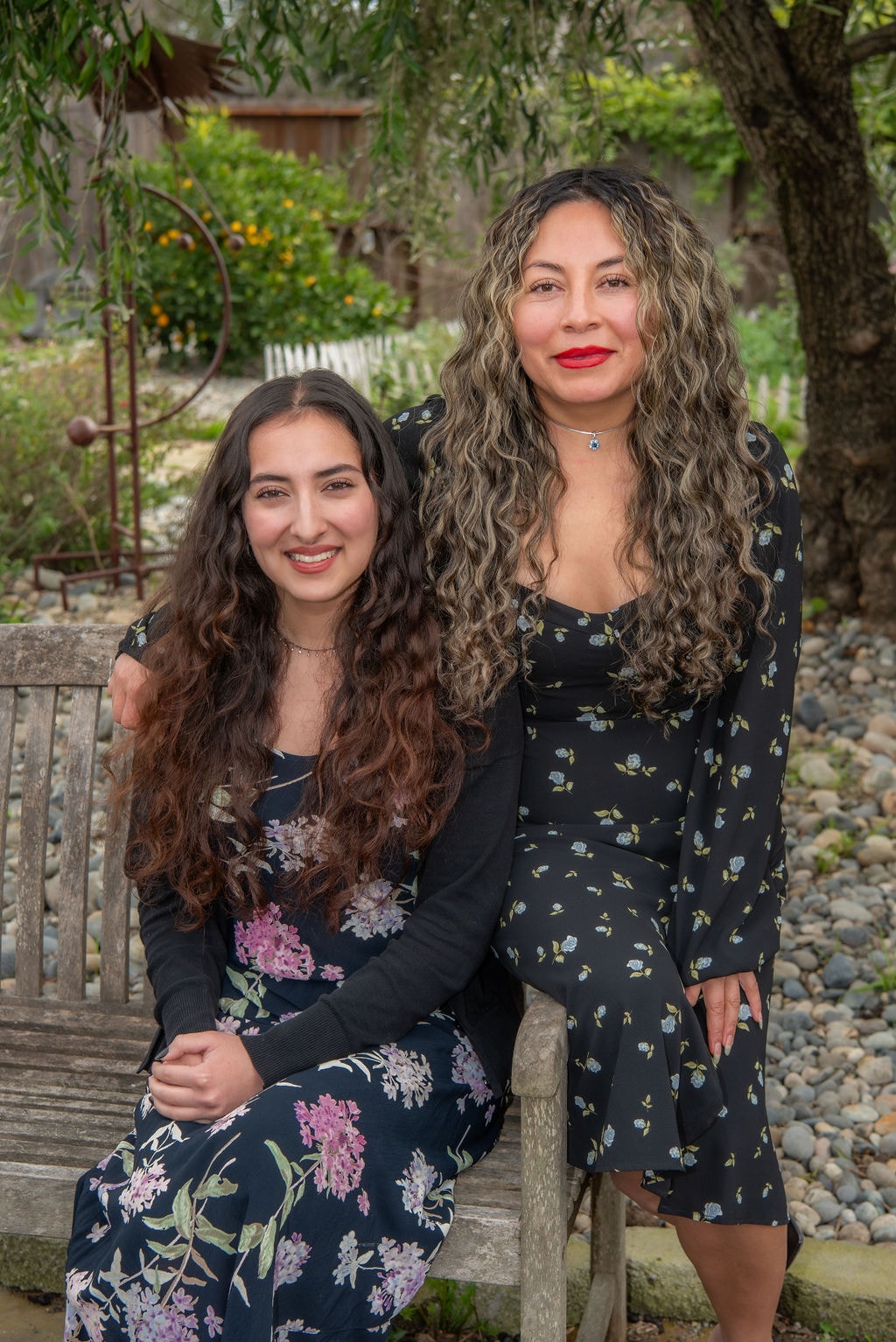 Associate planners Rose Torres and Layla Shapiro together on a garden bench